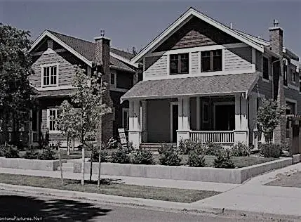 A typical neat single family house in a middle class neighborhood